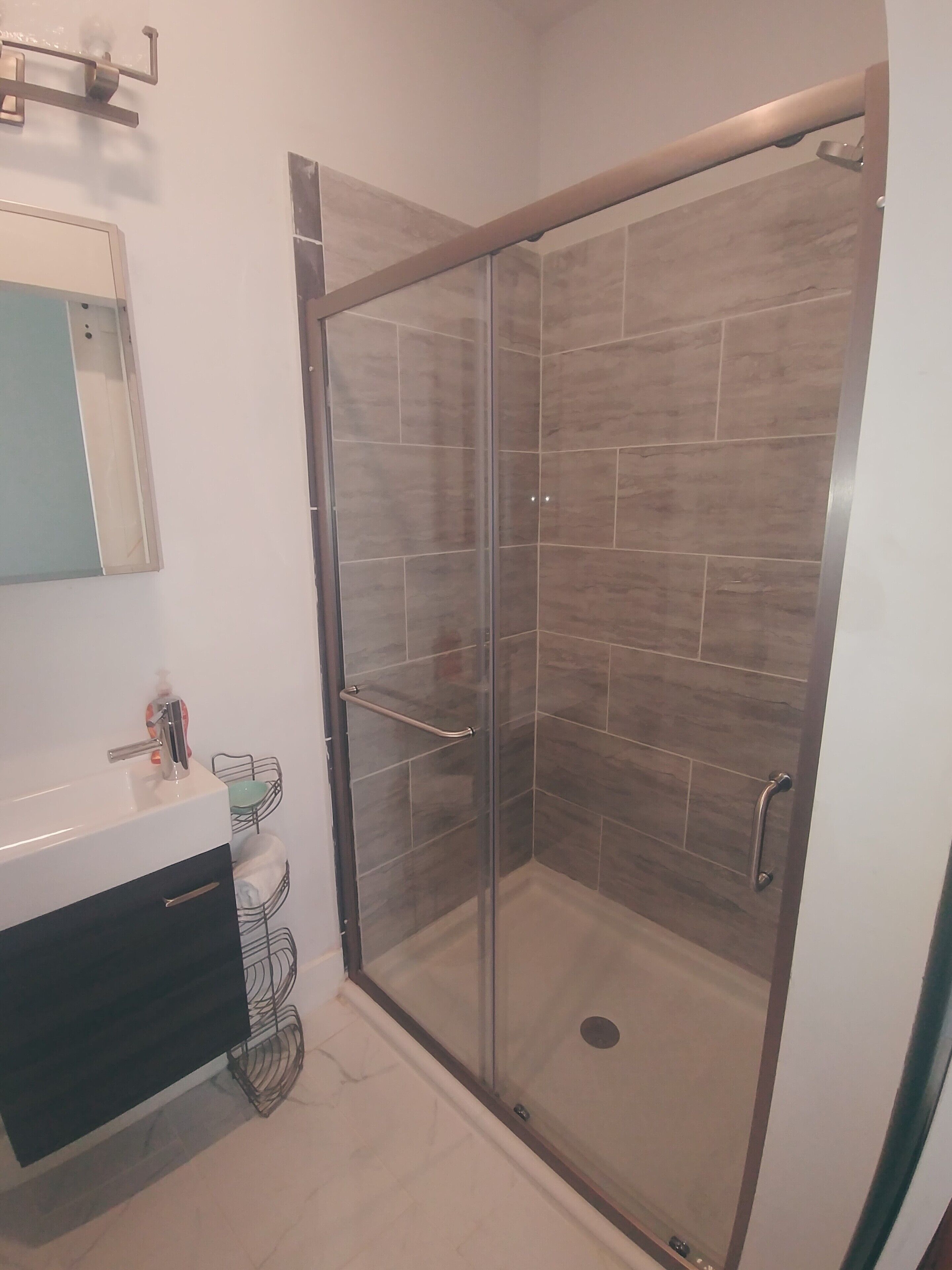 Combined shower/tub, hair dryer, towels, soap