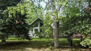 A house surrounded by trees in a wooded area.