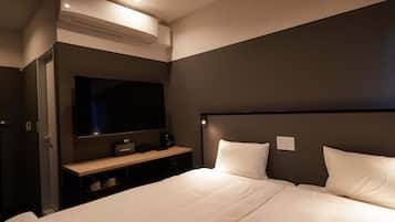 Habitación estándar con 2 camas individuales | Escritorio, tabla de planchar con plancha, wifi gratis y ropa de cama