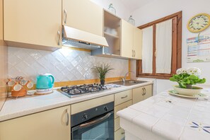 Family Apartment, Multiple Bedrooms (Blue&Green House With Shared Pool) | Private kitchen | Fridge, oven, stovetop, coffee/tea maker - Blue&green House With Shared Pool (Golfo Aranci)