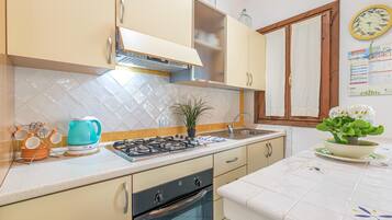 Family Apartment, 1 Bedroom (Blue&Green House With Shared Pool) | Private kitchen | Fridge, oven, stovetop, coffee/tea maker