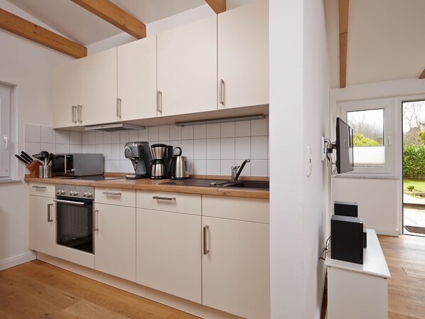 Microwave, stovetop, dishwasher, coffee/tea maker