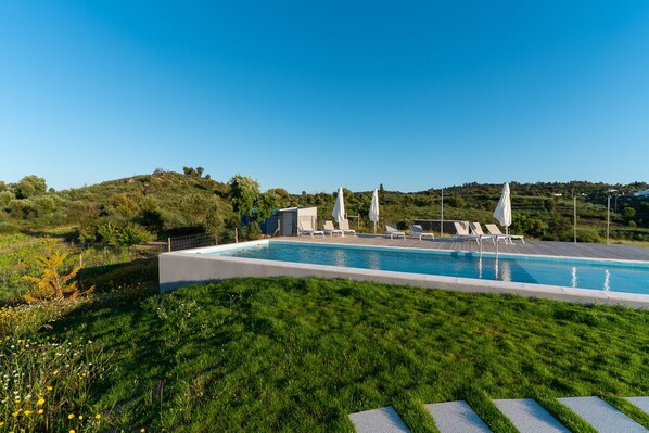 Outdoor pool, pool umbrellas, pool loungers