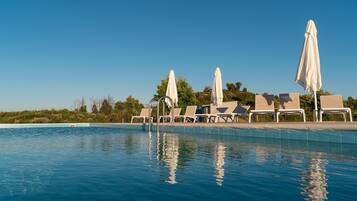 Outdoor pool, pool umbrellas, pool loungers