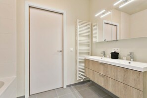 Bathtub, hair dryer, towels, soap
