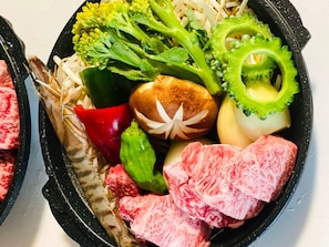 A meal with various vegetables and meat.