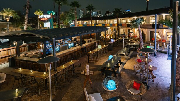 An outdoor bar area with tables, chairs, and a pool table. - Egyptian Motor Hotel, Bw Signature Collection (Phoenix)