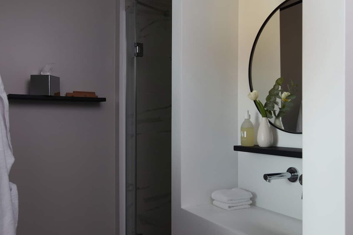 designer toiletries, hair dryer, bathrobes, slippers