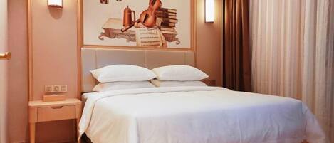 A hotel room with a bed, nightstands, a wall-mounted light fixture, and a curtain.
