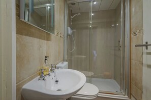Combined shower/bathtub, hair dryer, towels, soap