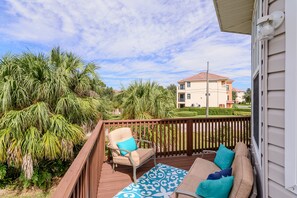 Relax on the balcony with two comfortable lounge chairs and take in the views of the surrounding neighborhood.