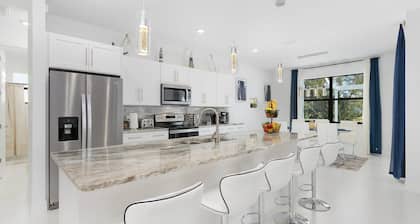 Modern 4BD/3BH Waterfront Home with Heated Pool and Golf Access and EV Charger