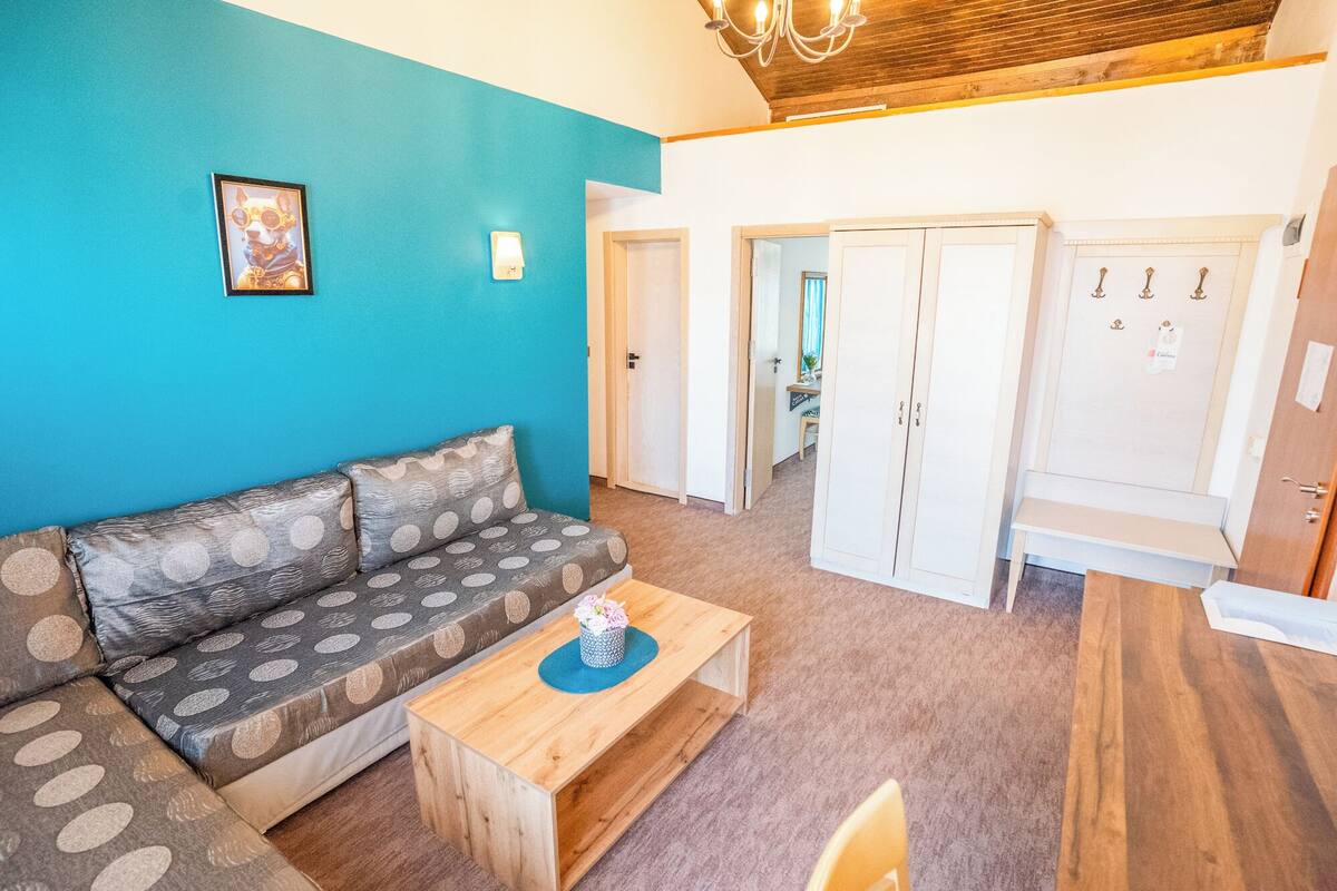 Premium Apartment, 2 Bedrooms | Living area | 17-inch flat-screen TV with cable channels