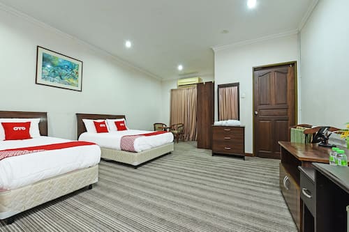 Habitación triple Deluxe | Ropa de cama