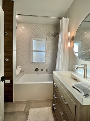 Combined shower/tub, hair dryer, towels, soap