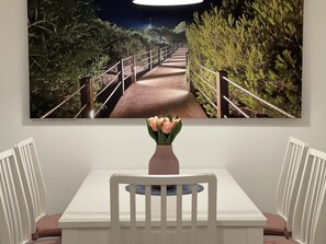 Enjoy meals in this stylish dining area with a beautiful centerpiece and a stunning view above.