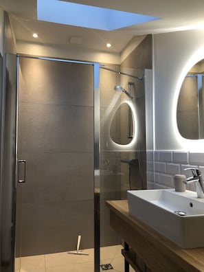 Bathtub, hair dryer, towels, soap