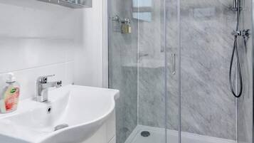 Shower, hair dryer, shampoo