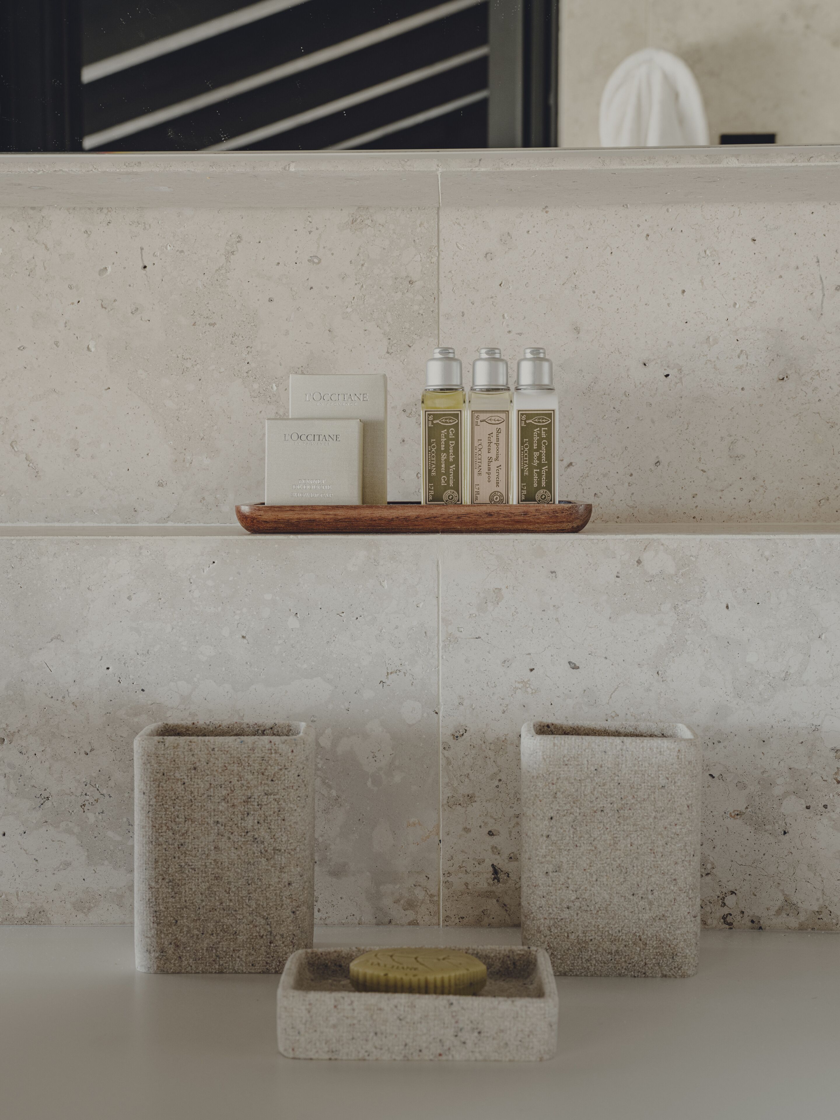 designer toiletries, hair dryer, bathrobes, slippers