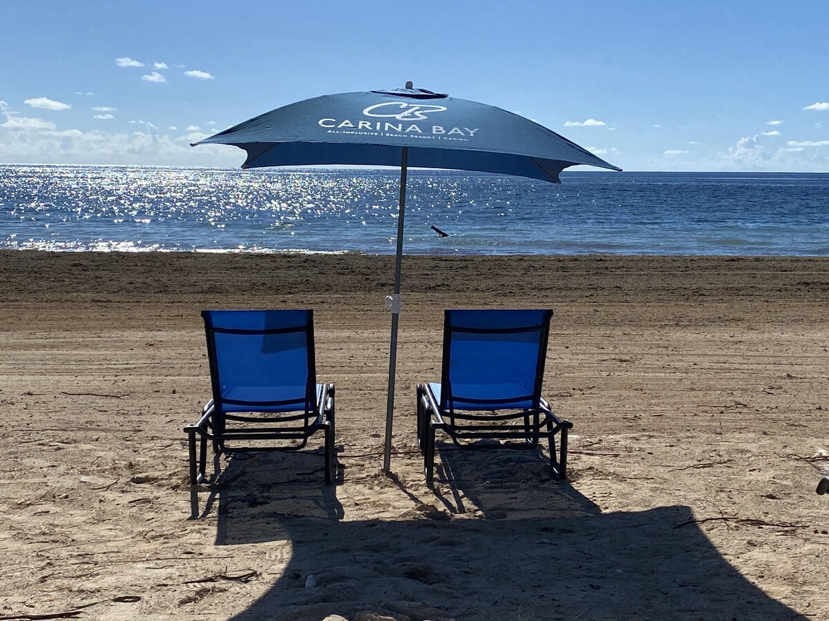 On the beach, beach umbrellas, beach towels, beach bar