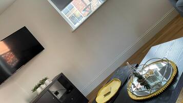 Room, 1 Bedroom | Living area | 32-inch flat-screen TV with satellite channels, TV