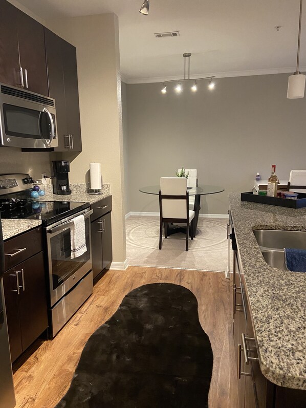 Microwave, dishwasher, coffee/tea maker, cookware/dishes/utensils