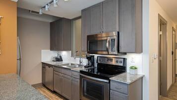 Fridge, coffee/tea maker, cookware/dishes/utensils