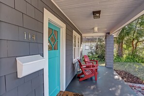 Relax on the porch with Adirondack chairs and enjoy the serene surroundings.
