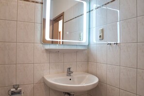 Regadera y secadora de cabello 