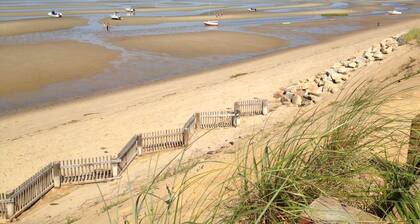 Walk to bay-side beach from this updated, cozy Cape Cod getaway