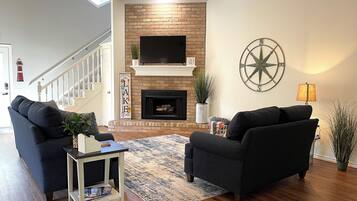 Smart TV, fireplace, books