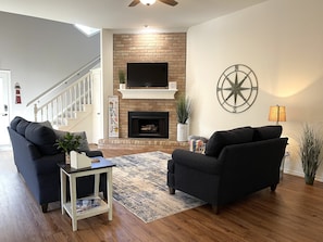 Smart TV, fireplace, books