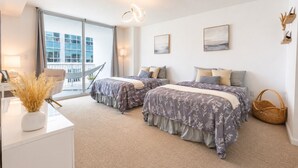 A modern bedroom with two beds, a large window, and a balcony. - 4 bed boho condo with amazing view *Comfortable, stylish and clean* (Miami)