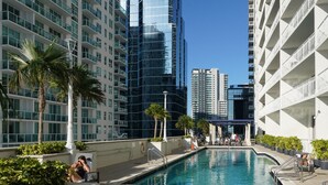 A modern hotel with a pool area, featuring high-rise buildings and palm trees. - 4 bed boho condo with amazing view *Comfortable, stylish and clean* (Miami)
