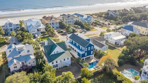 A coastal residential area with houses, a beach, and a swimming pool. - Luxury, Oceanview Beach Home w/ Private Pool & Outdoor Kitchen, Hot Tub, Rooftop Deck, & Elevator! (Isle Of Palms)