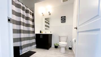 Combined shower/tub, hair dryer, towels, soap