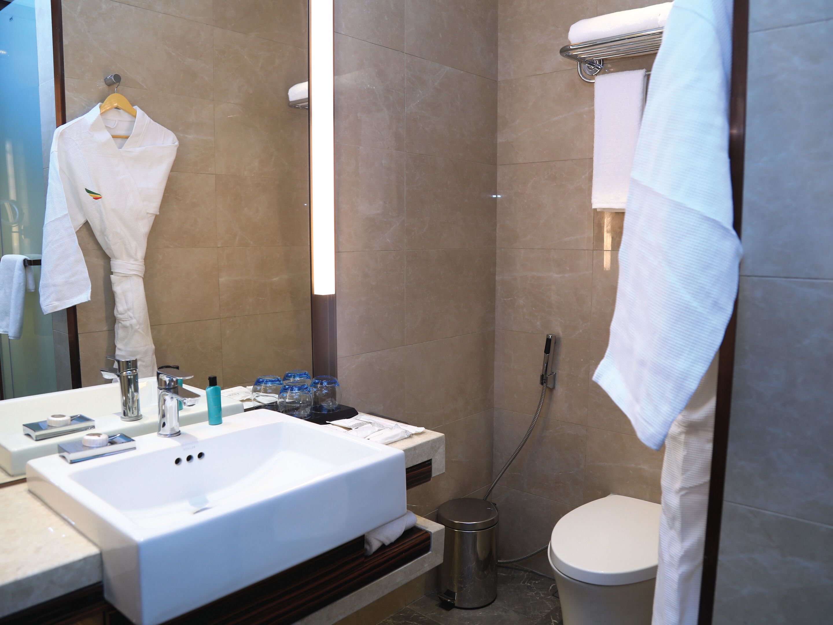 bathrobes, slippers, towels, soap