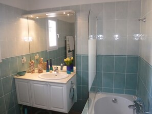 Combined shower/tub, hair dryer, towels, toilet paper