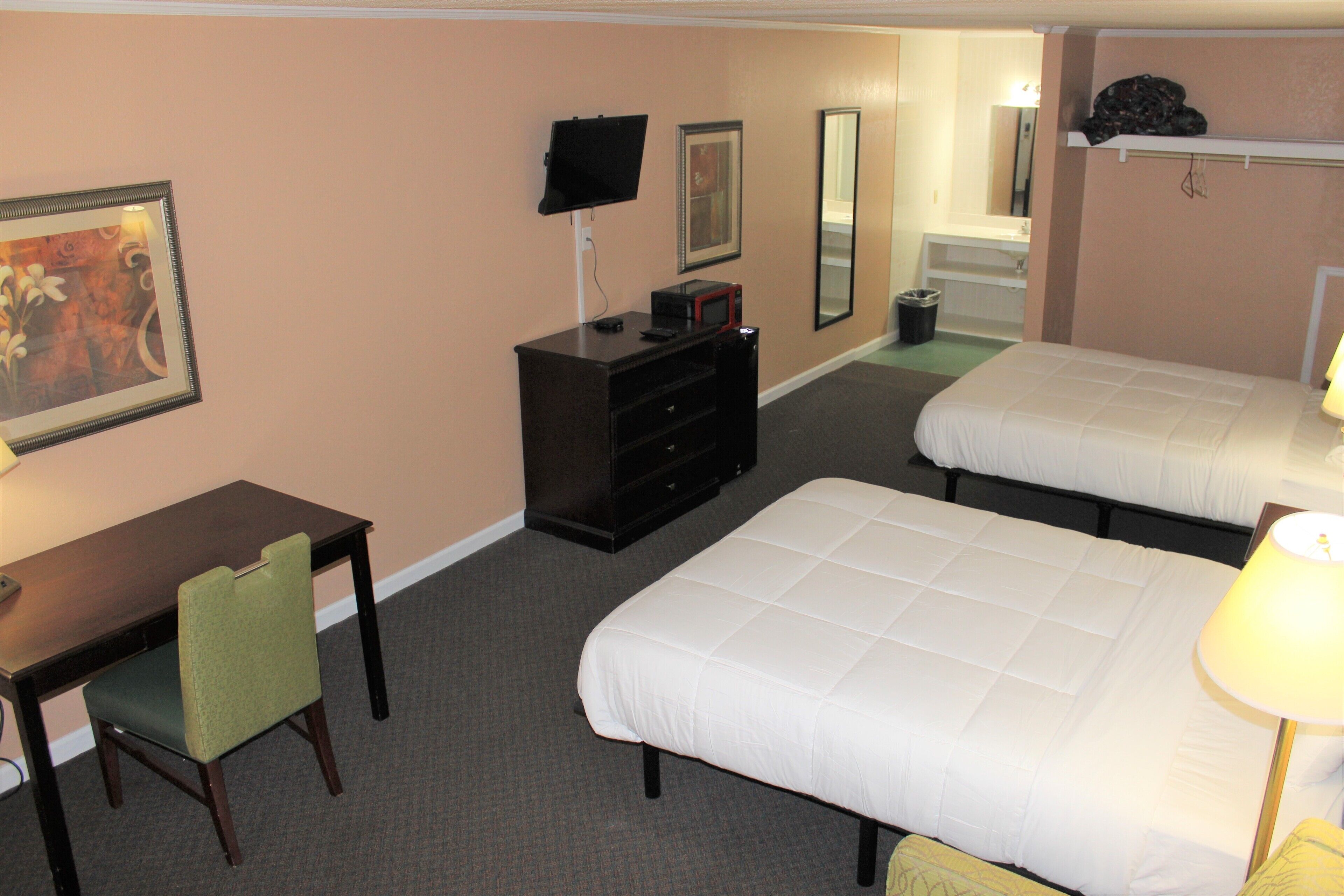 business quadruple room | premium bedding, pillow-top beds, individually decorated
