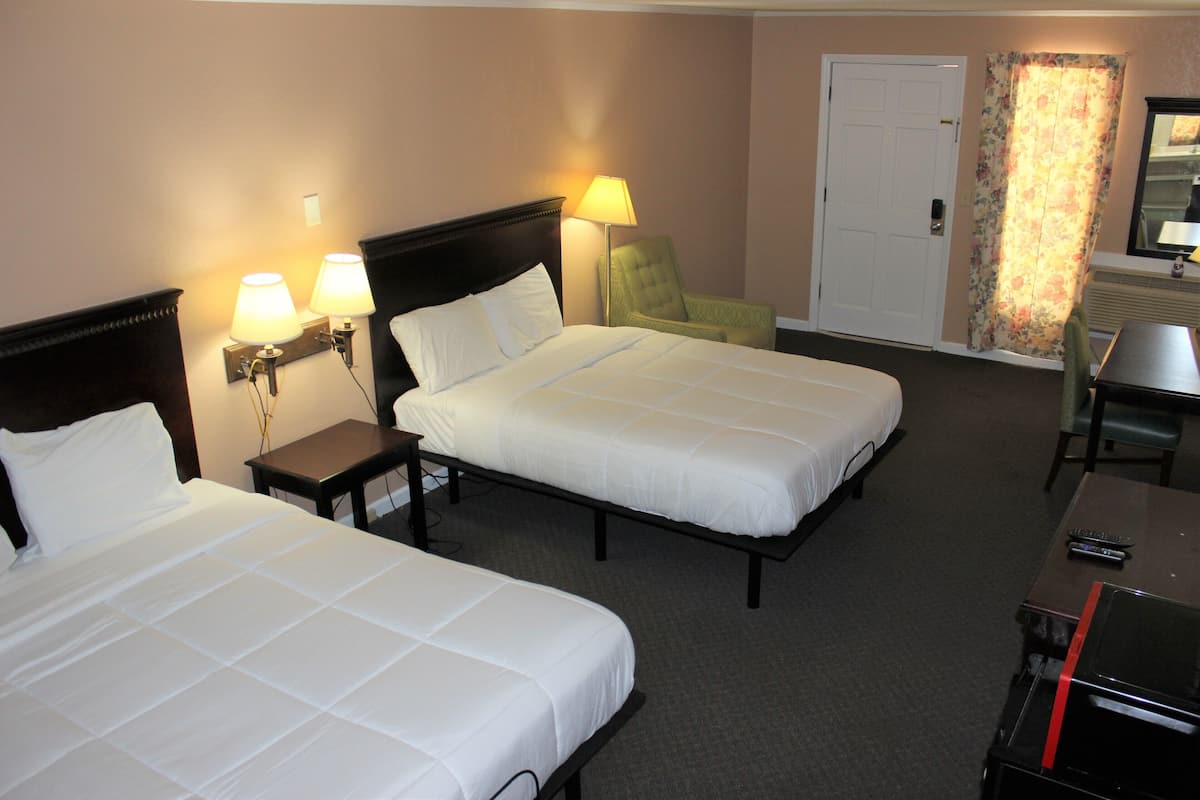 business quadruple room | premium bedding, pillow-top beds, individually decorated