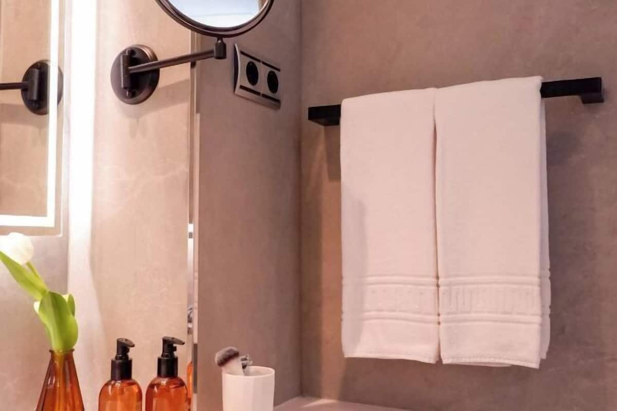 Bathroom | Shower, rainfall showerhead, hair dryer, towels