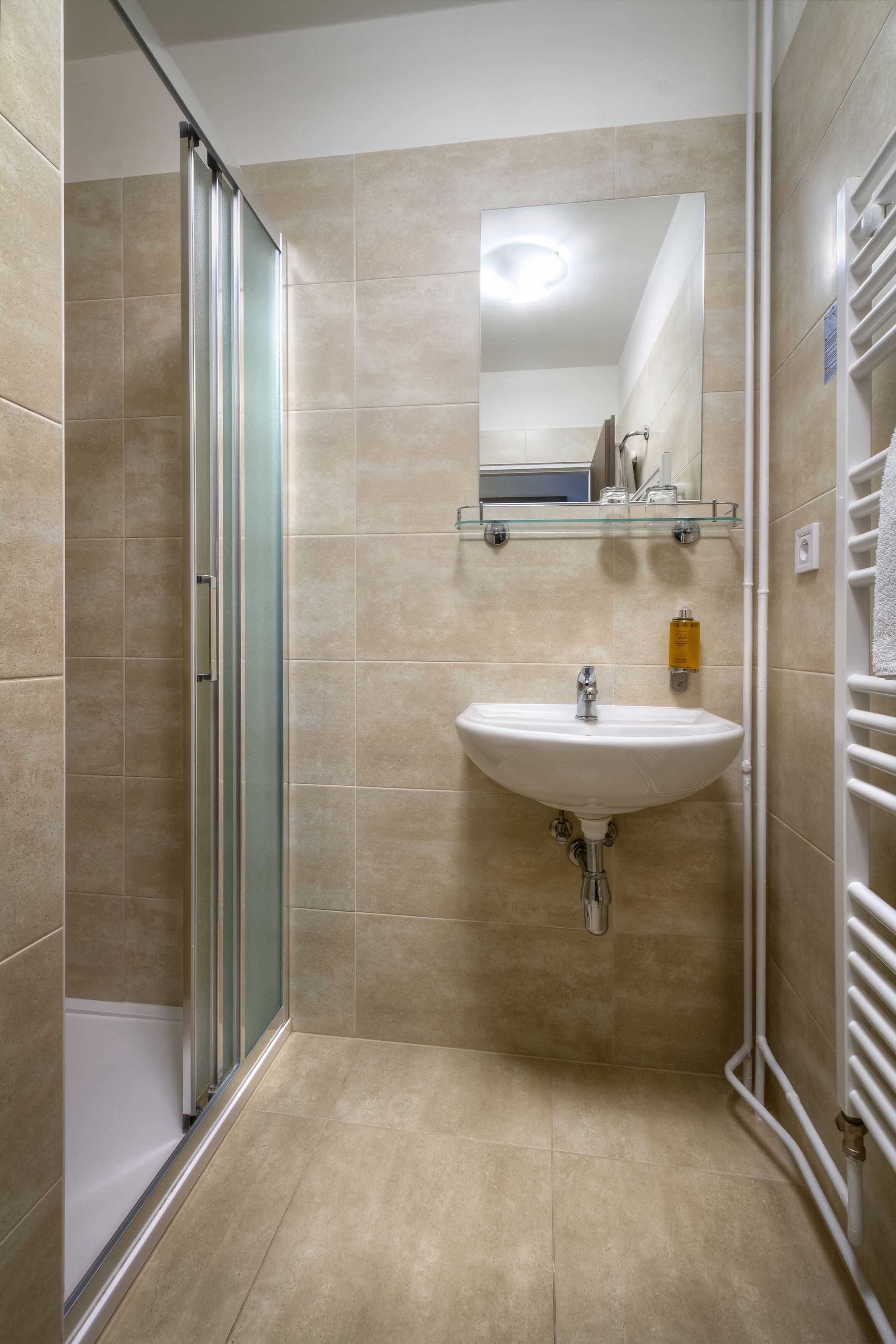 standard double room | bathroom | shower, eco-friendly toiletries, hair dryer, towels