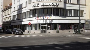 A multi-story building with the sign "HOTEL HARMONY" prominently displayed. - Hotel Harmony (Prague)