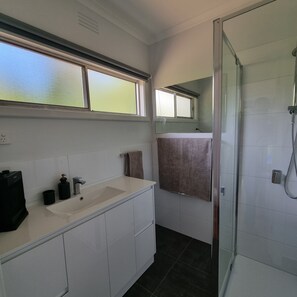 Shower, hair dryer, towels, soap