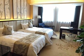 A hotel room with two beds, a desk, a chair, and a large window with curtains. - Timing International Hotel Zhoukou (Zhoukou)