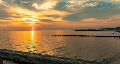 Charming apartment with sauna and large terrace, just a few steps from the beach.