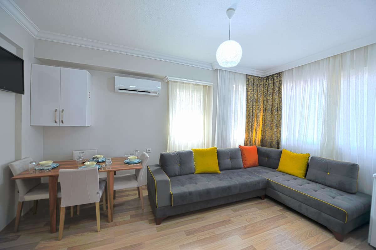 Deluxe Apartment | Living area | 55-cm LED TV with satellite channels, TV