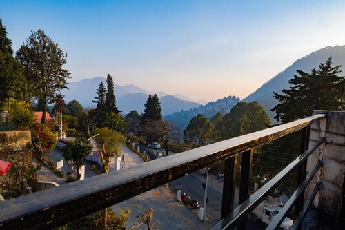 Peaceful, scenic, surrounded by green or snowy hills, far away from the city....