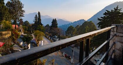 Peaceful, scenic, surrounded by green or snowy hills, far away from the city....