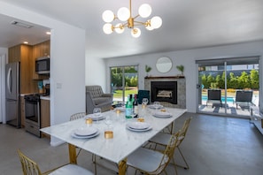 Enjoy meals in the kitchen with a gas stove, microwave, and refrigerator. Relax by the fireplace in the cozy seating area.